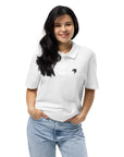 Model wearing Unisex Organic Cotton Embroidered Logo Polo Shirt in White