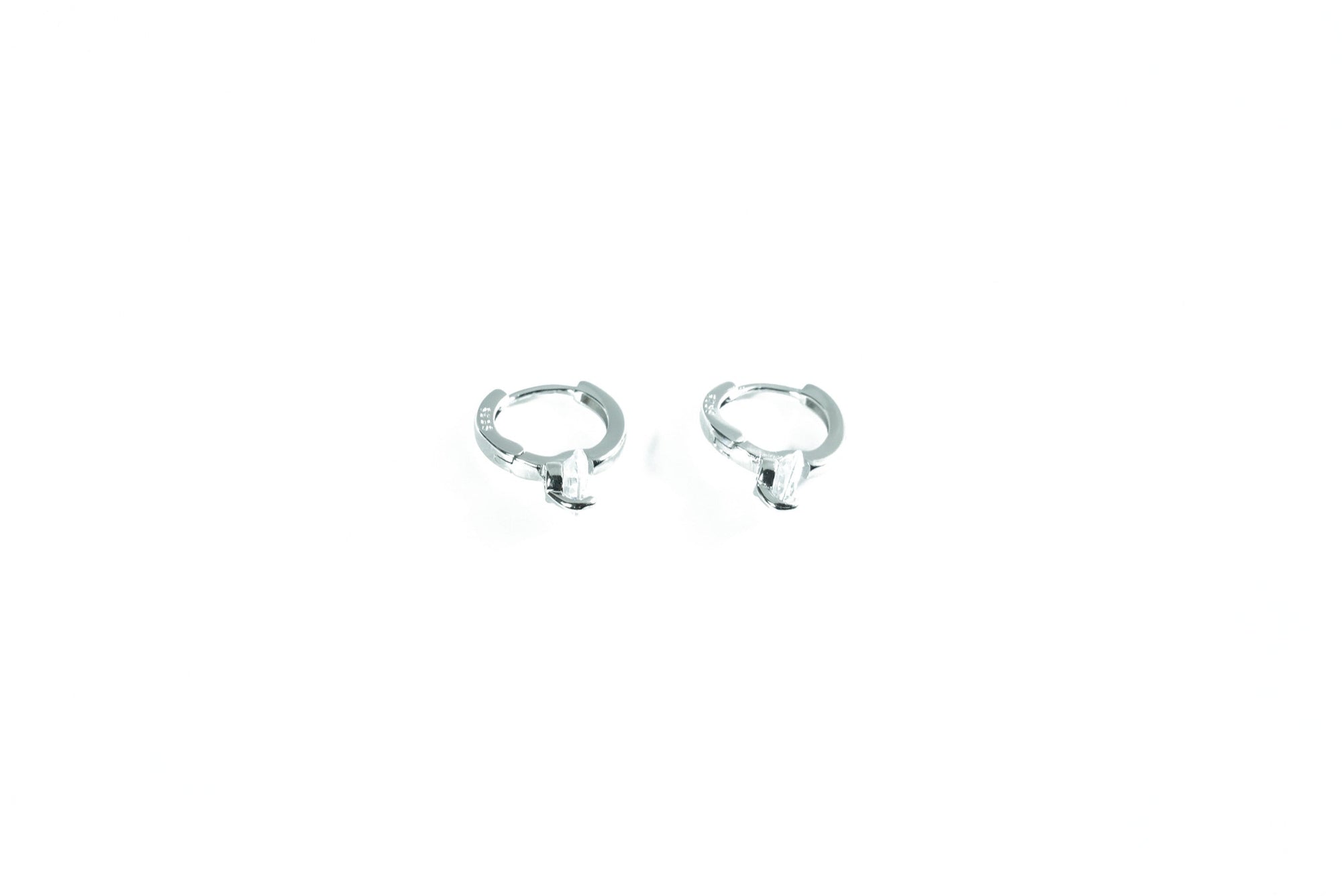 timeless silver earring with a subtle diamond shaped ring pendant