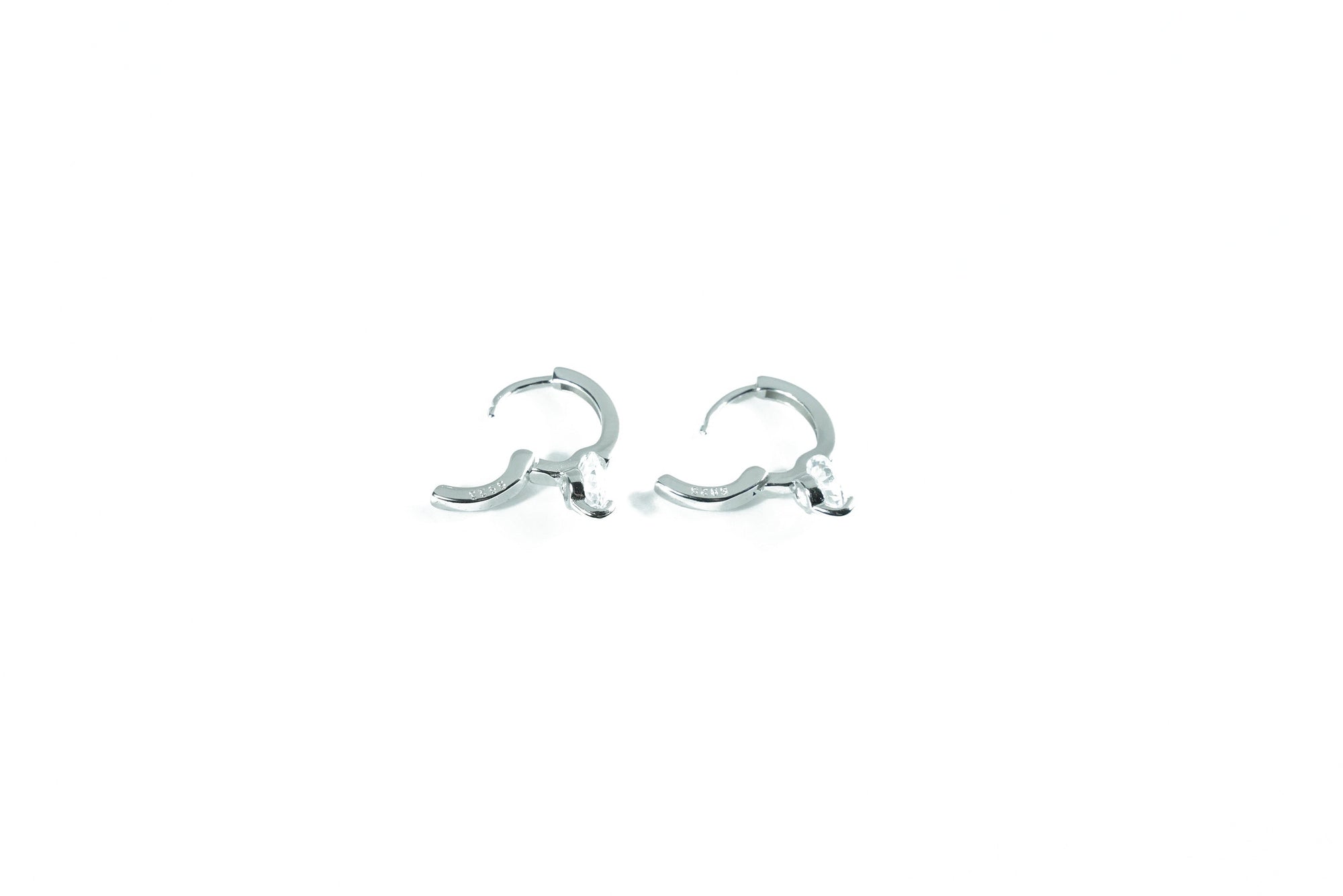 timeless silver earring with a subtle diamond shaped ring
